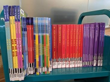 Road to Decode Books stacked on a shelf. 