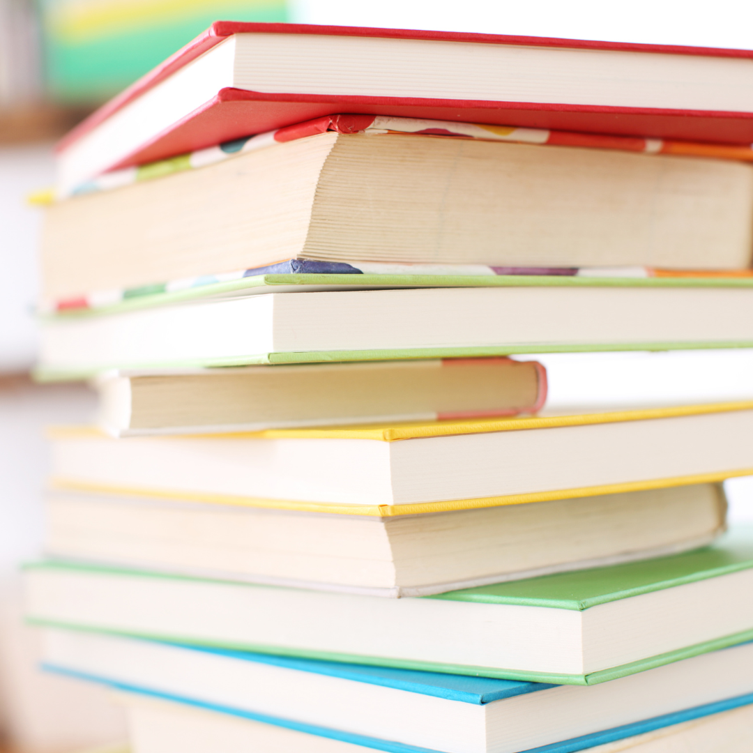 stack of books in front of a white background